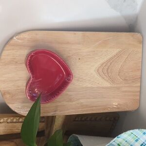 Heart-Shaped Red Dish on Wooden Board